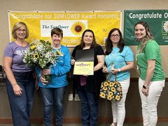 Angie Smith, CNA, and Sunflower award winner with OSF Saint Luke leaders