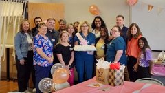 joann smetters standing with group of nurses at party smiling for photo