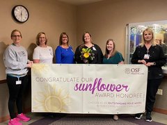 Kaylynn McNamee, CMA, and Sunflower award winner with OSF Saint Luke and OSF Medical Group leaders