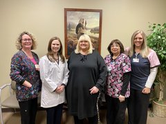 Pictured is Tamra Gonzalez, a patient of OSF Wound Care, with Brittany Jones, DPM, a podiatrist and podiatric surgeon who cares for patients at OSF Wound Care in Ottawa, along with Mission Partners from the clinic.